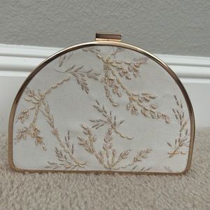 a new day half moon beaded clutch